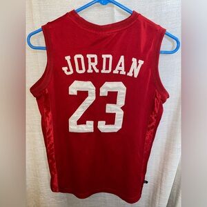 Air Jordan basketball jersey junior size L so fits like an adult small in men’s.